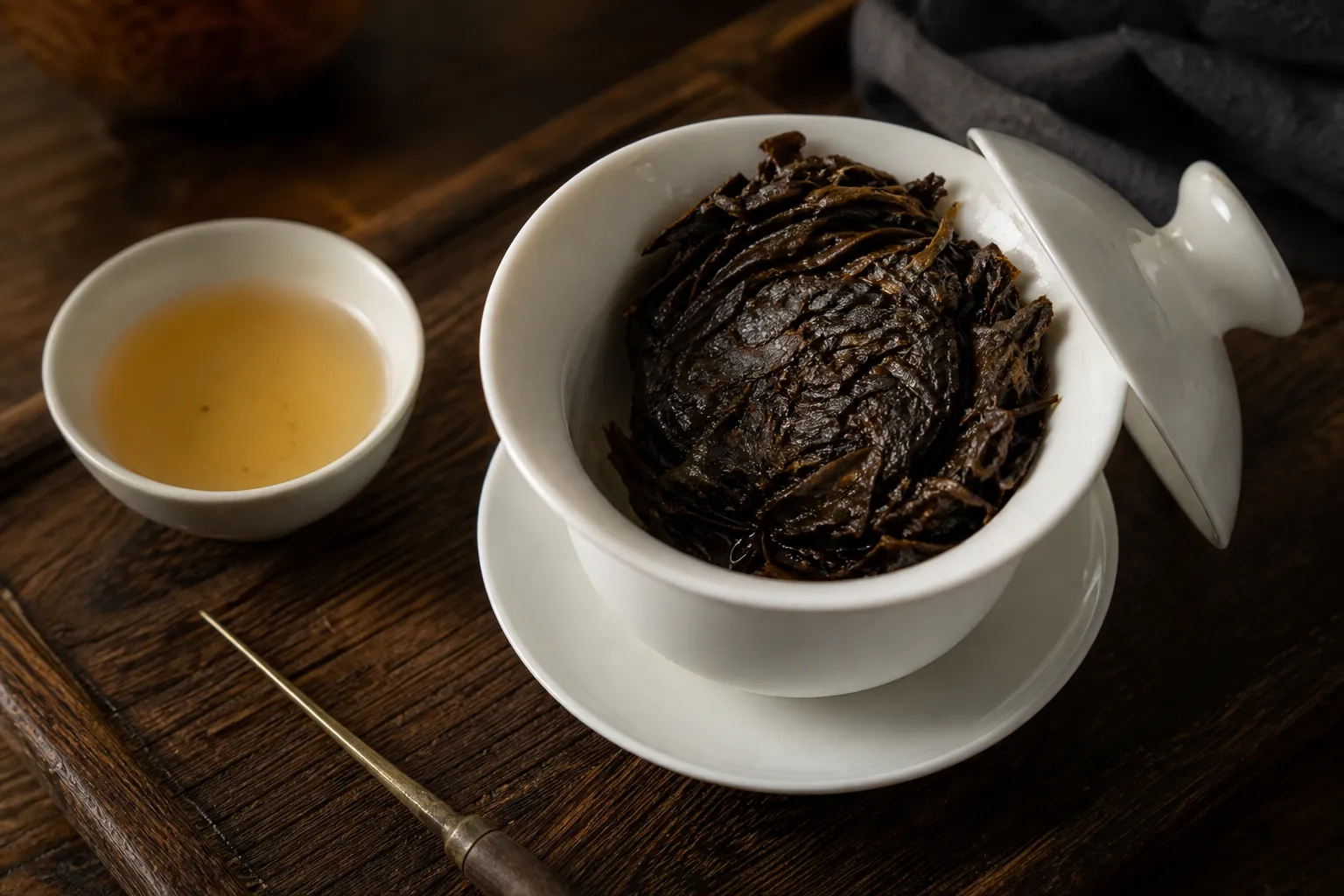 Rinsed center piece of dark tea cake beginning to loosen while some layers remain clumped